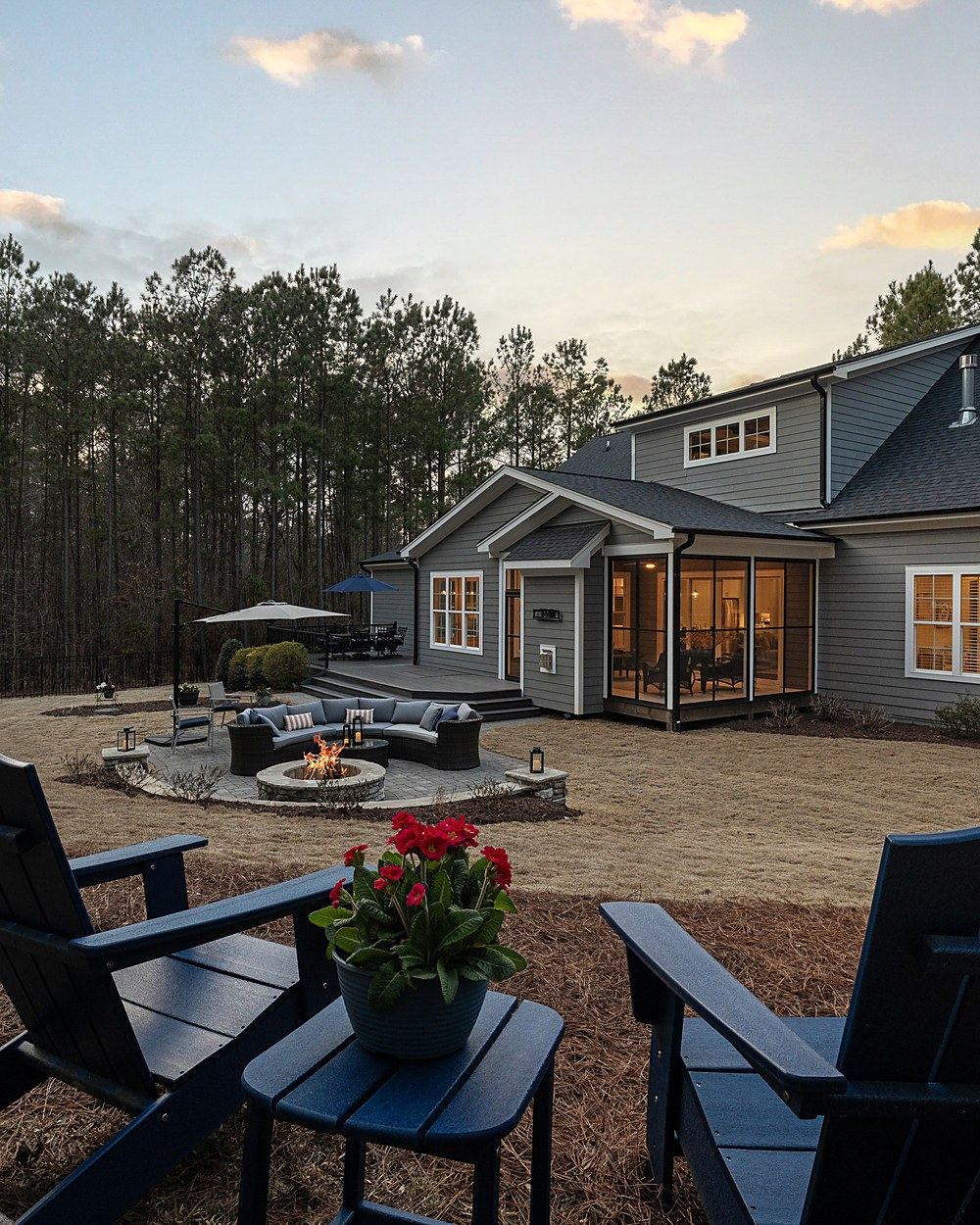 Backyard deck and patio living space, evening